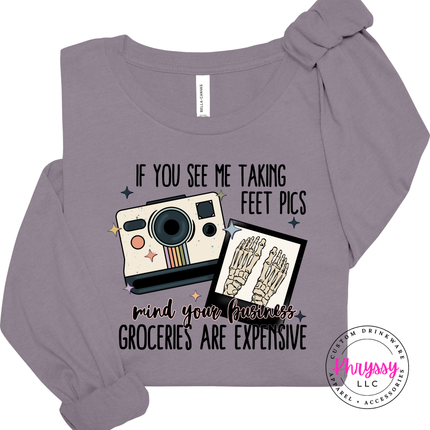 Purple long-sleeve shirt with graphic design and text on a white background