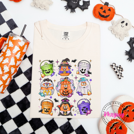 Ivory colored tee with a nostalgic Halloween candy bucket illustration.
