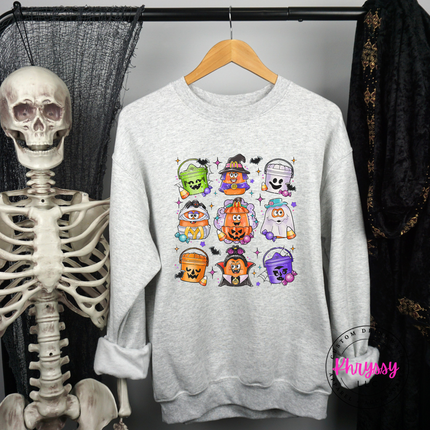 Woman wearing an Ash crewneck sweatshirt with a candy bucket design.