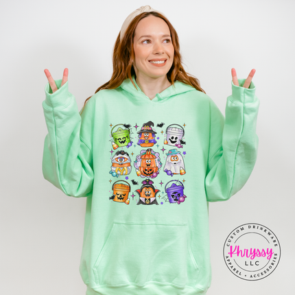 Mint hoodie featuring a colorful trick-or-treat bucket collage print.