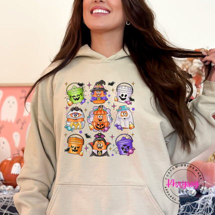 Sand colored hoodie featuring nine trick-or-treat bucket characters.