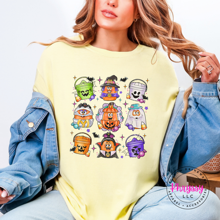 Woman wearing a Banana yellow graphic tee with a candy bucket design.