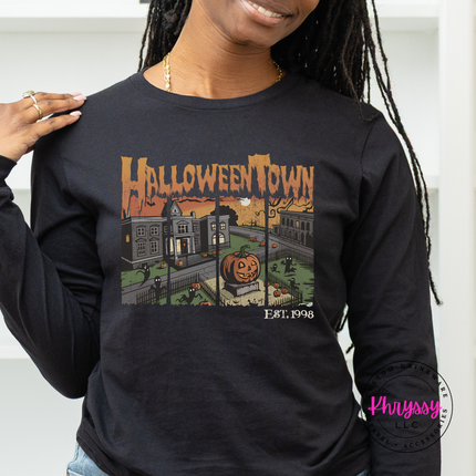 Black long sleeve featuring a glowing jack-o-lantern town scene.
