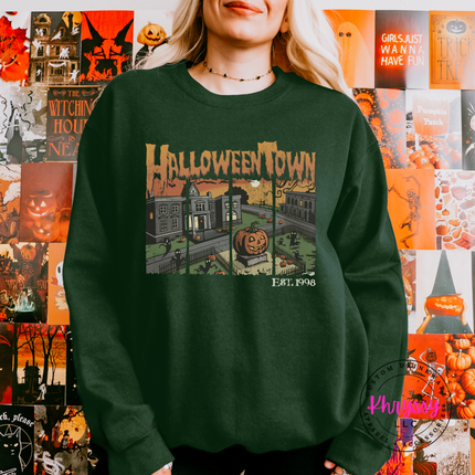 Cozy Forest fleece crewneck featuring a glowing jack-o-lantern town scene.
