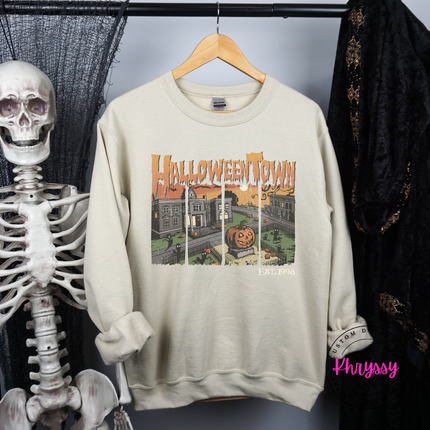 Sand crewneck sweatshirt styled for fall with a spooky town graphic.