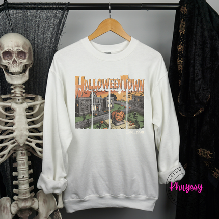 White fleece crewneck with a moody Halloween town design.