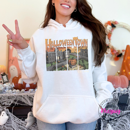 White hoodie with the Halloween town vintage scene graphic