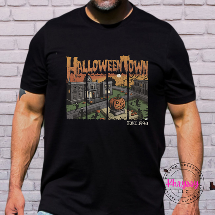 Woman wearing a Black Comfort Colors tee with a Halloweentown spooky graphic.
