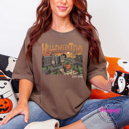 Espresso pigment-dyed tee featuring a glowing jack-o-lantern town scene.