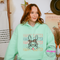 Mint hoodie with a leopard bunny and stacked Happy Easter print.