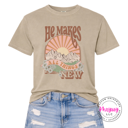 Khaki relaxed tee featuring daisies and an earthy scripture sunset graphic.