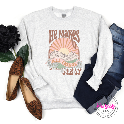 Ash Grey crewneck with a retro sunset and He Makes All Things New design.