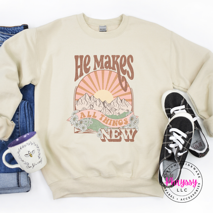 Sand crewneck showing boho mountains and a vintage sunburst.
