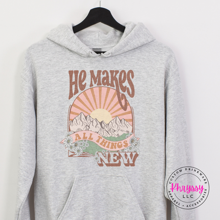 Ash Grey hoodie with a retro sunset and He Makes All Things New design.