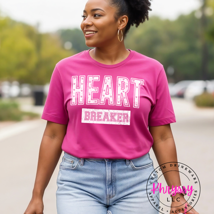Woman wearing a pink 'HEART BREAKER' t-shirt outdoors