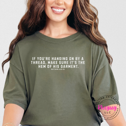 Sage tee with the hanging on by a thread scripture in white text