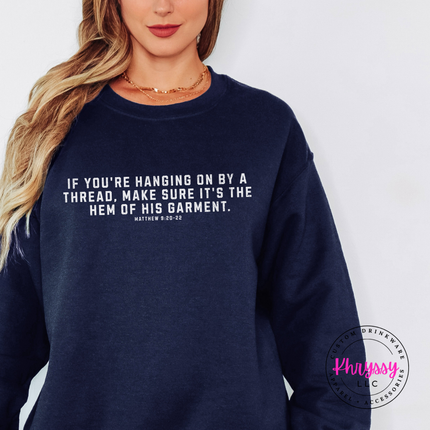 Navy crewneck sweatshirt with white hem of His garment Christian quote