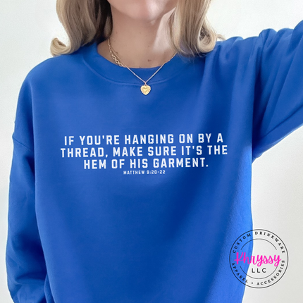 Royal Blue crewneck sweatshirt with white hem of His garment faith lettering
