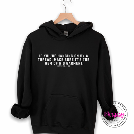 Black hoodie featuring the hanging on by a thread faith verse in white