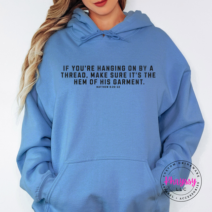Carolina Blue hoodie with black hem of His garment Christian quote