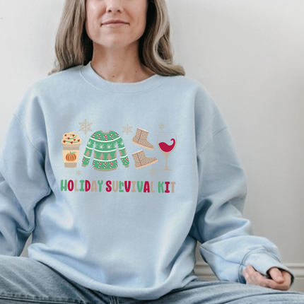 Light Blue crewneck sweatshirt showing a latte, a sweater, boots, and a glass.