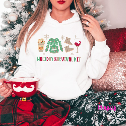 Flat lay of the Holiday Survival Kit Christmas hoodie in White.