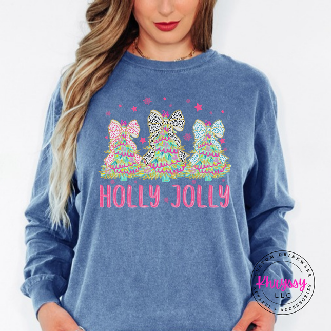 Model wearing the Holly Jolly bow tree long sleeve tee in Blue Jean.