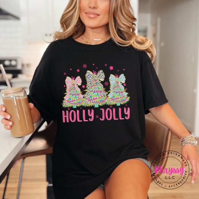 Black tee featuring three bow topped Christmas trees and Holly Jolly lettering.