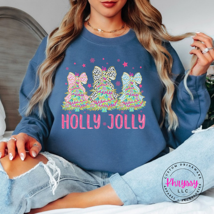 Indigo Blue crewneck sweatshirt showing glittery bow trees over pink Holly Jolly letters.