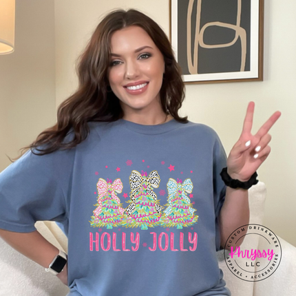 Model wearing the Holly Jolly bow tree tee in Blue Jean.
