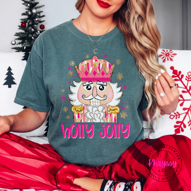 Close up of the Holly Jolly nutcracker art on a Blue Spruce tee.