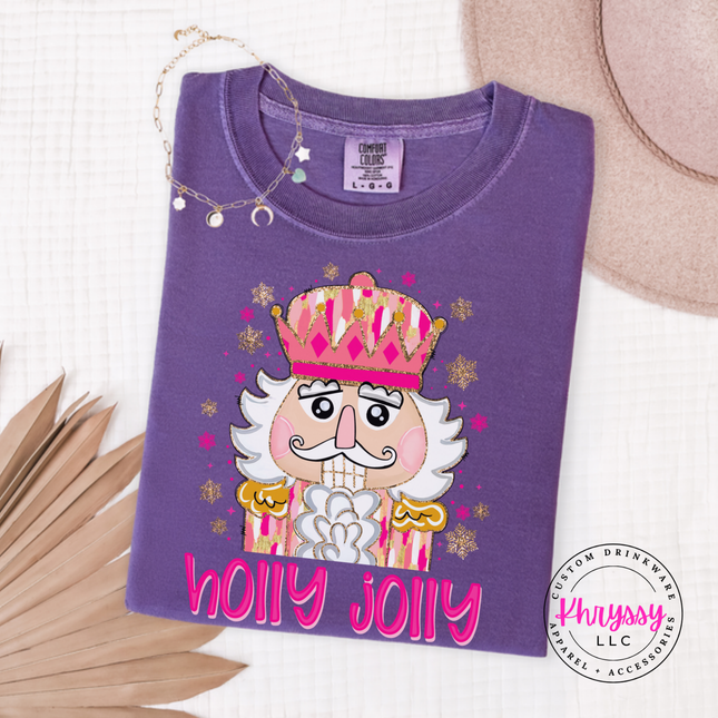 Flat lay of the Holly Jolly nutcracker Christmas long sleeve tee in Grape.