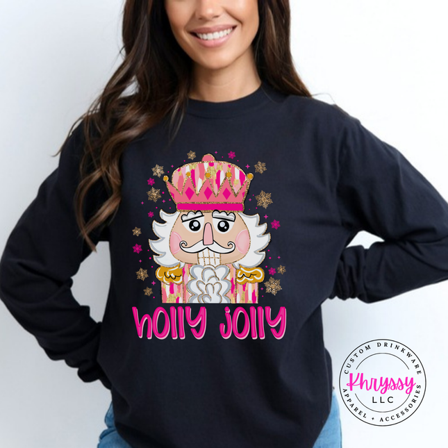 Black long sleeve tee featuring a sparkly nutcracker and holly jolly lettering.