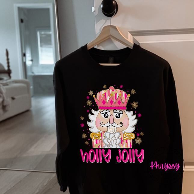 Black crewneck sweatshirt featuring a sparkly nutcracker and holly jolly lettering.
