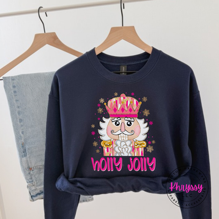 Close up of the Holly Jolly nutcracker art on a Navy crewneck sweatshirt.