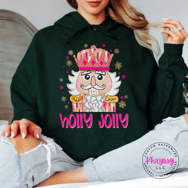 Forest hoodie showing a pink crowned nutcracker with snowflakes.