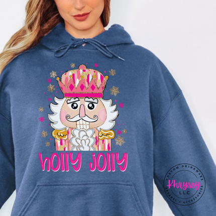 Indigo Blue hoodie featuring a sparkly nutcracker and holly jolly lettering.