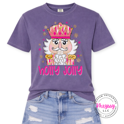 Flat lay of the Holly Jolly nutcracker Christmas tee in Grape.