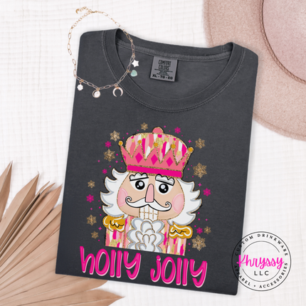Graphite tee featuring a sparkly nutcracker and holly jolly lettering.