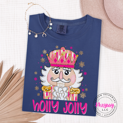 Close up of the Holly Jolly nutcracker art on a Navy tee.