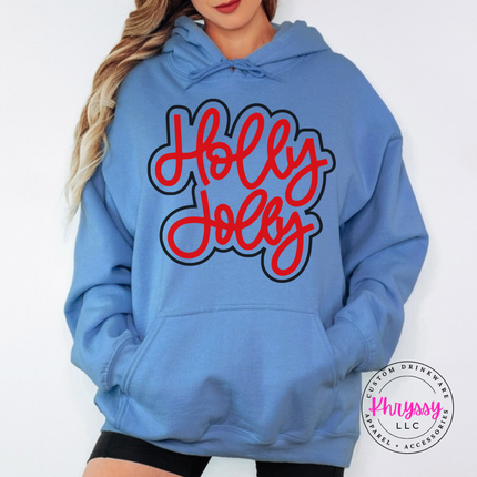 Carolina Blue hoodie with Holly Jolly in bold outlined Christmas script lettering