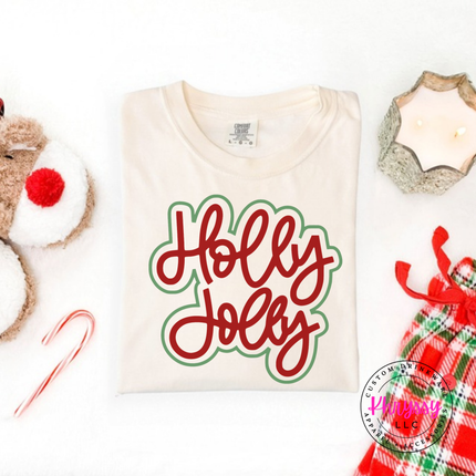 Ivory tee with Holly Jolly in bold outlined Christmas script lettering