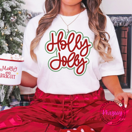 White tee with Holly Jolly in bold outlined Christmas script lettering