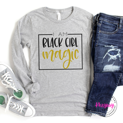Athletic heather shirt showing bold Black Girl Magic empowerment lettering.