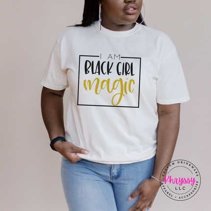Ivory tee with a Black Girl Magic affirmation in black and gold.