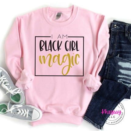 Light pink crewneck featuring black and gold Black Girl Magic lettering.