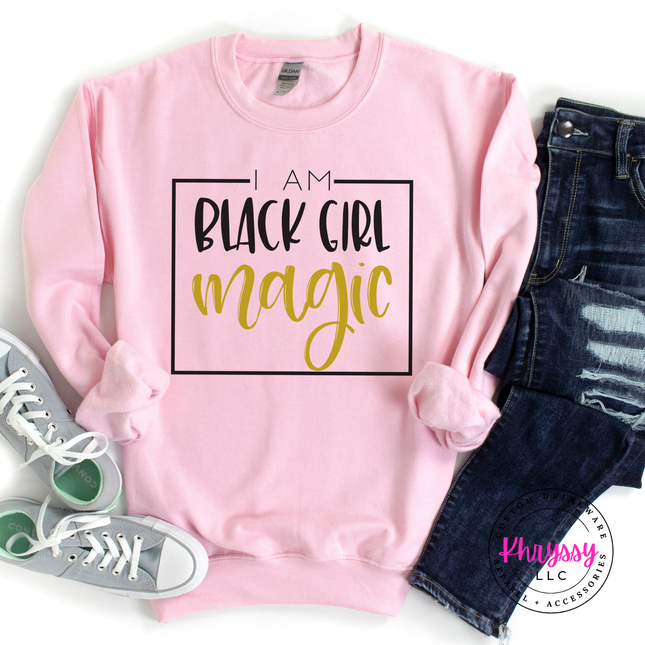 Light pink crewneck featuring black and gold Black Girl Magic lettering.