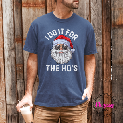 Denim tee showing a funny Santa with distressed lettering.