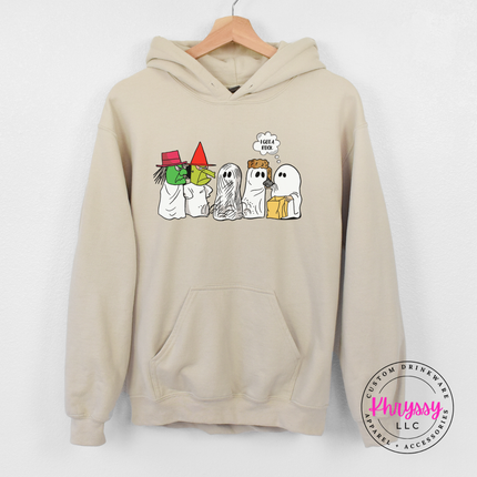 Sand colored hoodie featuring vintage-style Halloween ghosts and a sunset.