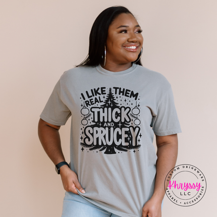 Gray tee with I Like Them Real Thick and Sprucey tree.
